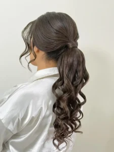 Slicked Low Ponytail Curly
